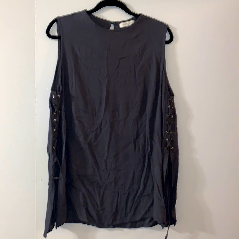 Worn once sleeveless tunic with side laces & slits